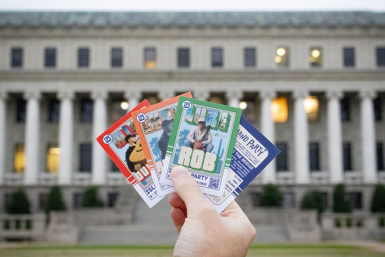 Artist announcement cards fanned out