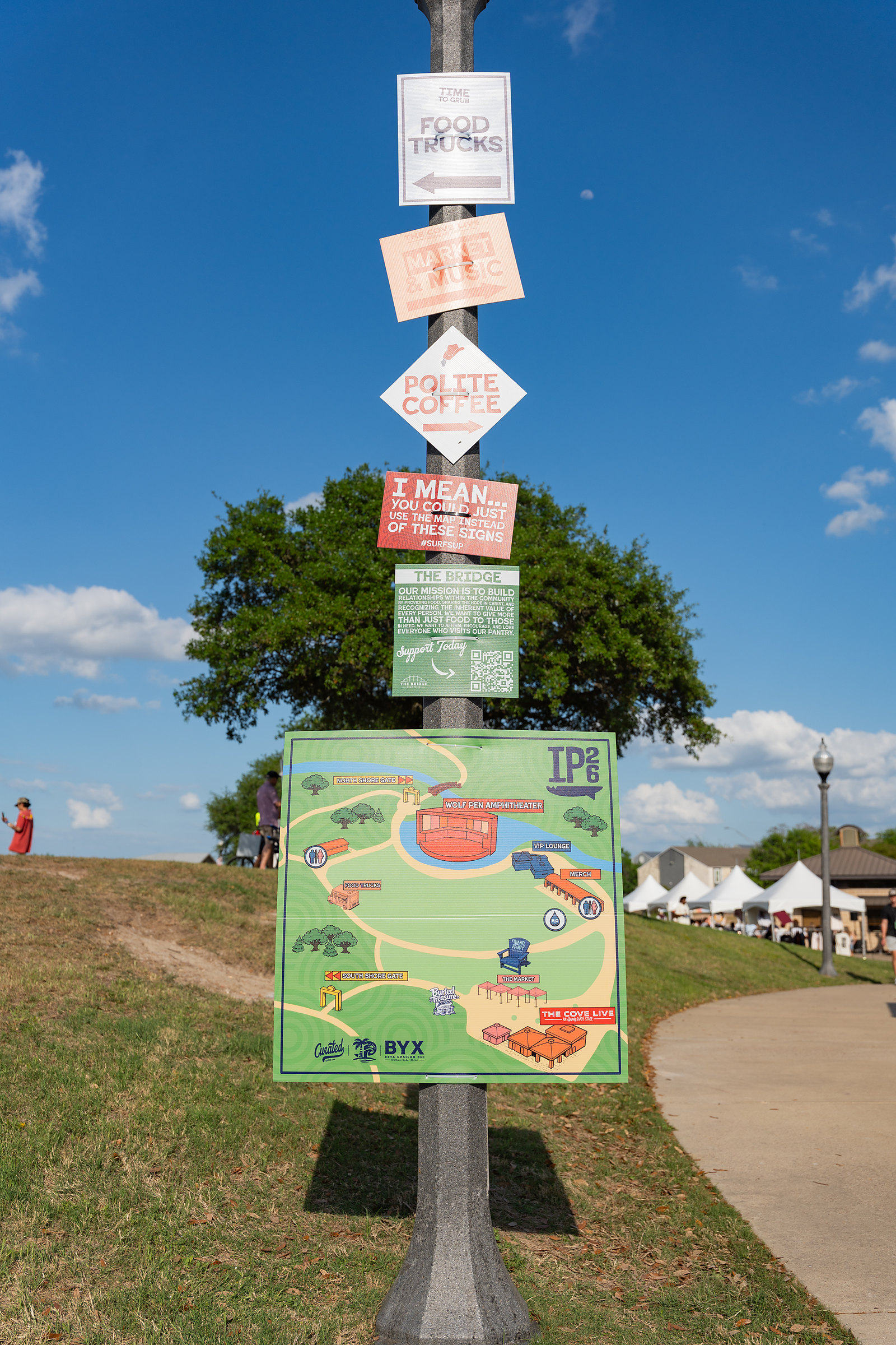 Wayfinding post with directionals and the guest map